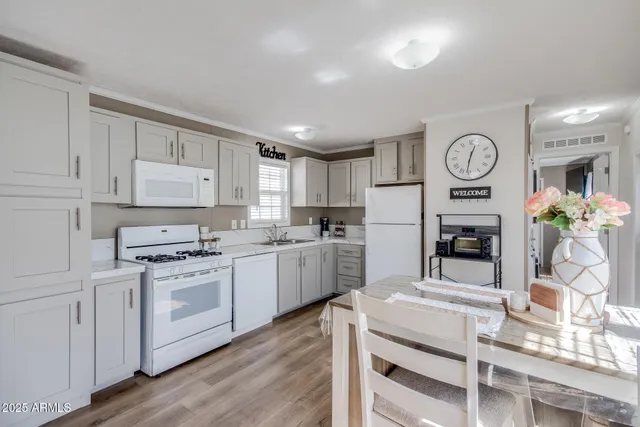 a kitchen with cabinets stainless steel appliances and a counter top space