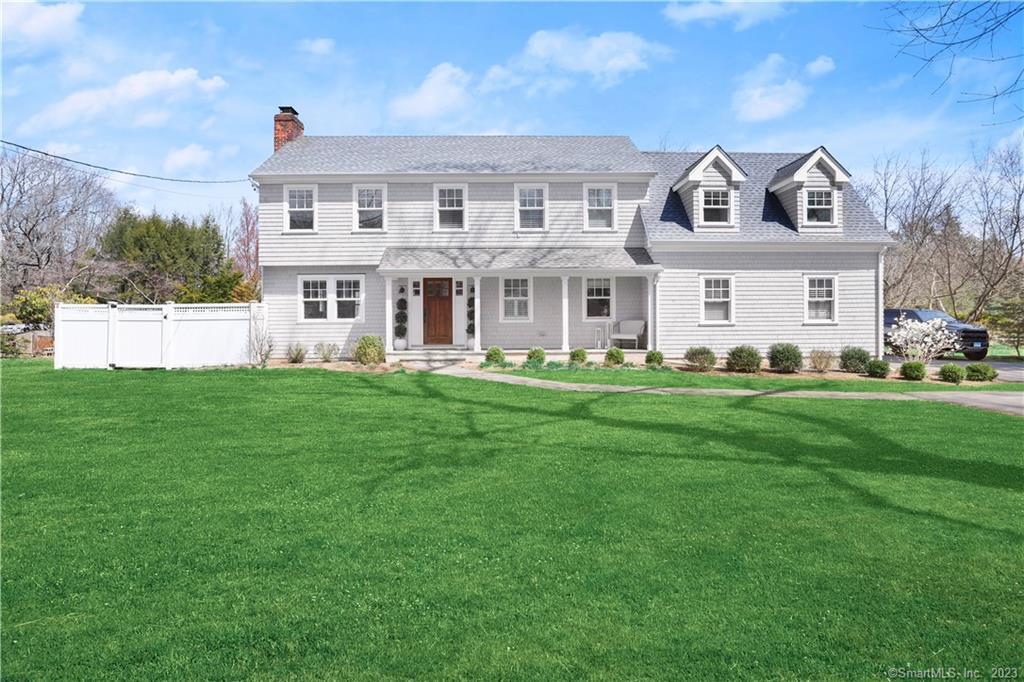 170 Raymond Street Darien, CT 06820 - Photo 1 of 1 a front view of a house with a garden and trees