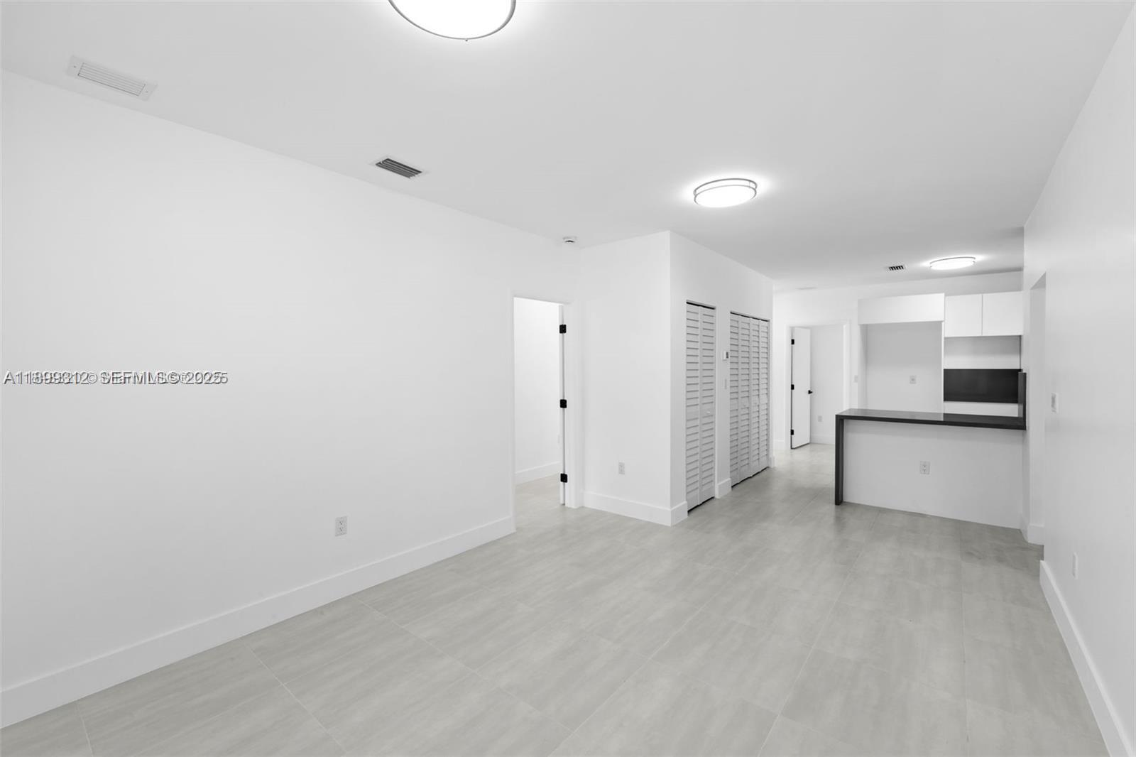 3710 Northwest 13th Place, Unit 1 Miami, FL 33142 - Photo 5 of 8 a view of a kitchen with a sink