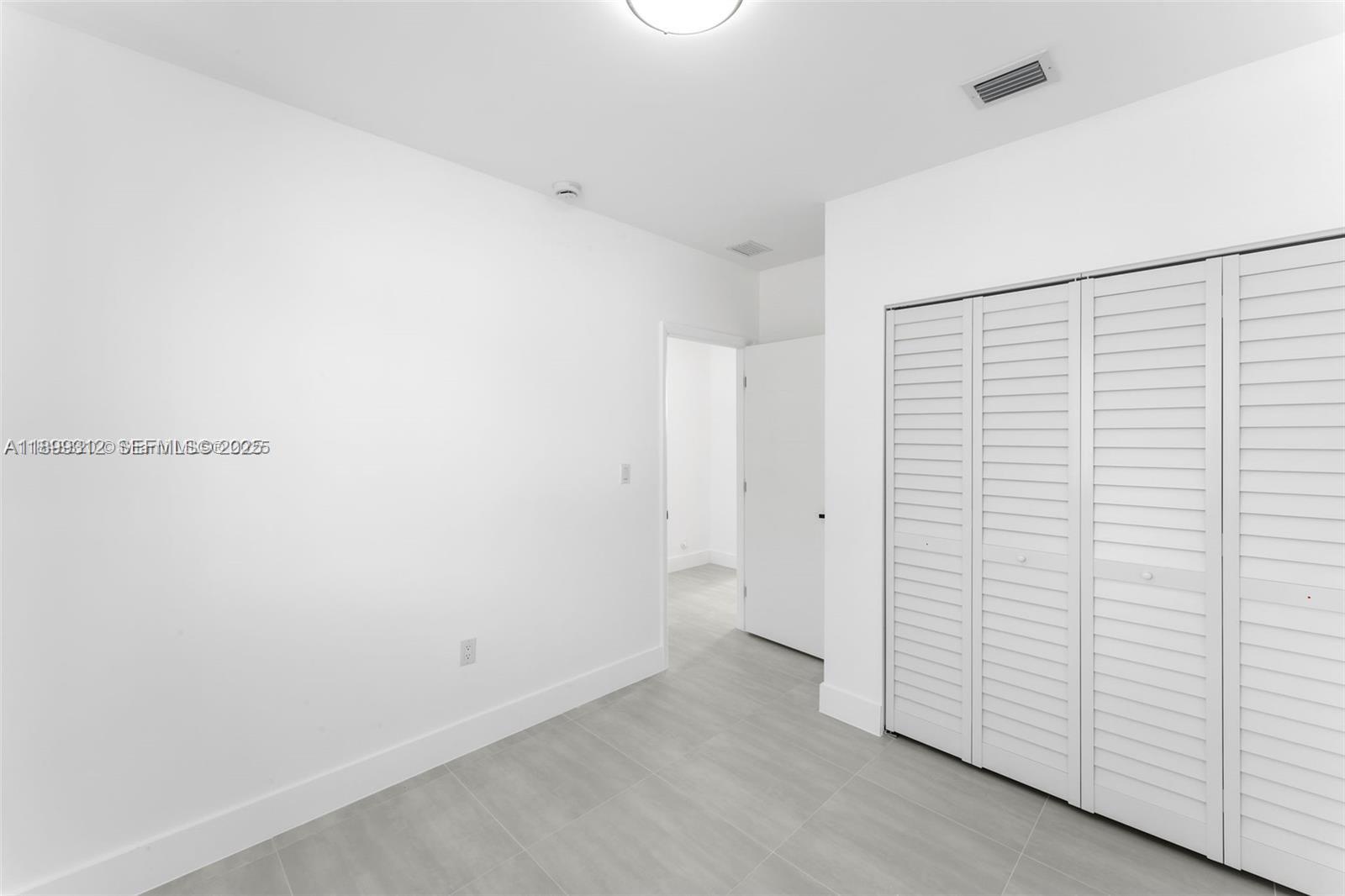 3710 Northwest 13th Place, Unit 1 Miami, FL 33142 - Photo 8 of 8 a view of an empty room