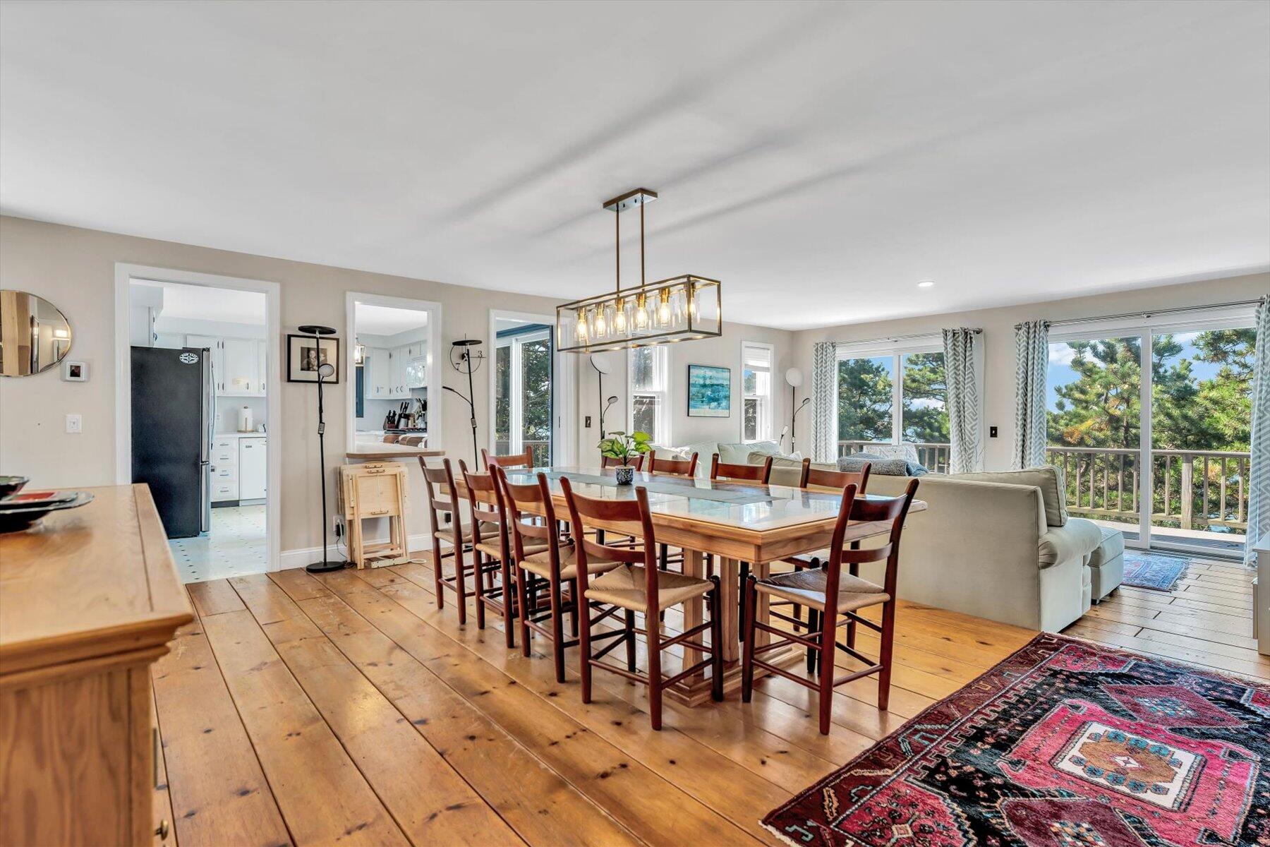 90 Ring Road Wellfleet, MA 02667 - Photo 13 of 86 a view of a dining room with furniture window and outside view