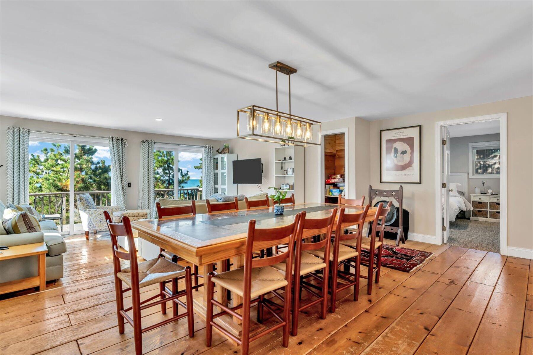 90 Ring Road Wellfleet, MA 02667 - Photo 14 of 86 a view of a dining room with furniture window and wooden floor