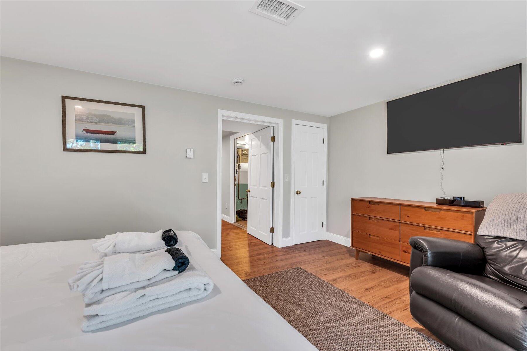 90 Ring Road Wellfleet, MA 02667 - Photo 27 of 86 a bedroom with a bed and flat screen tv