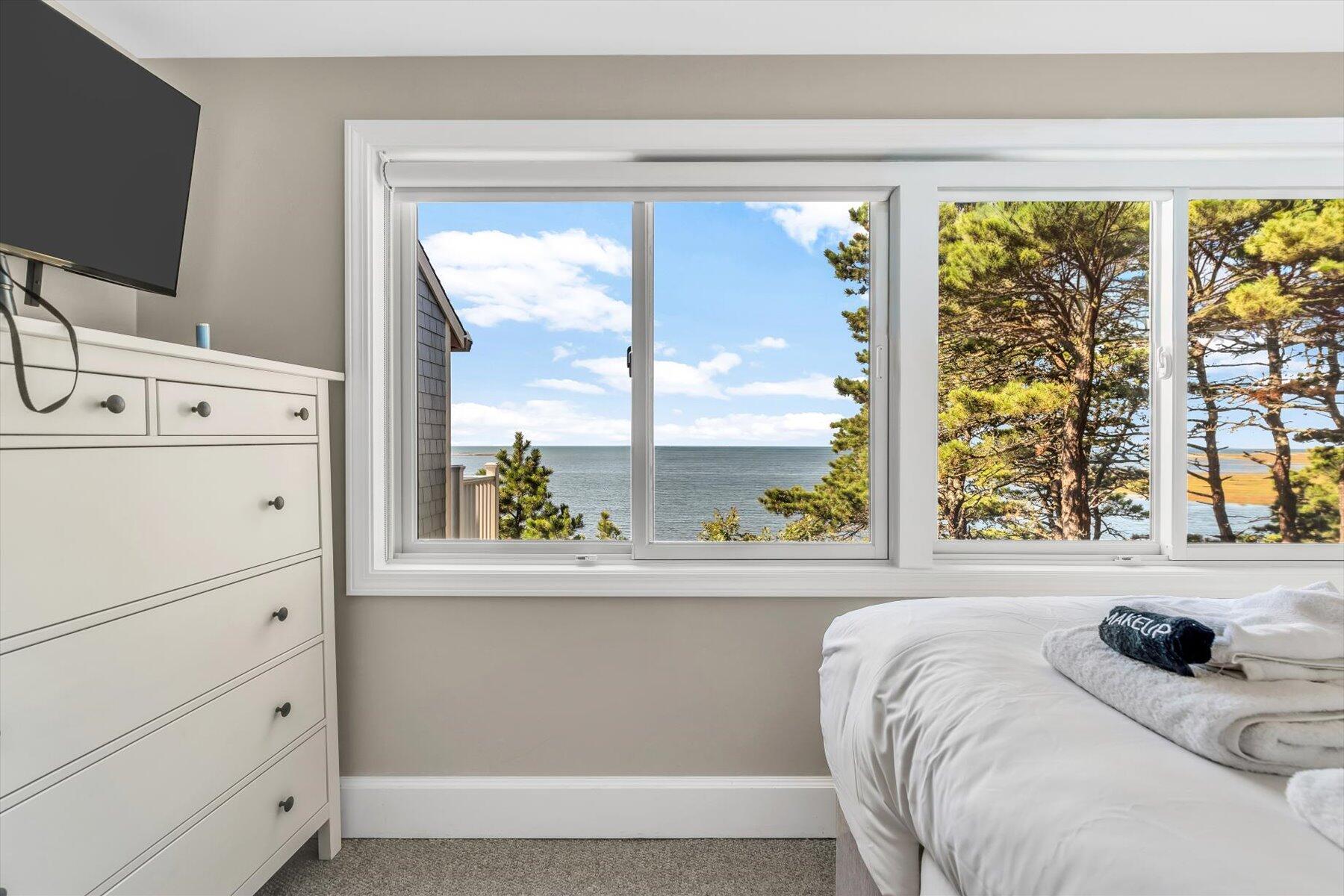 90 Ring Road Wellfleet, MA 02667 - Photo 39 of 86 a bedroom with a bed and a window