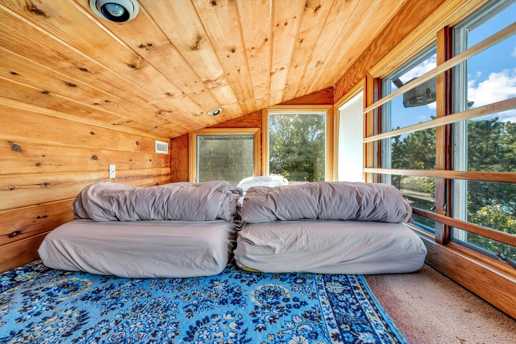 90 Ring Road Wellfleet, MA 02667 - Photo 49 of 86 a living room with furniture and a floor to ceiling window
