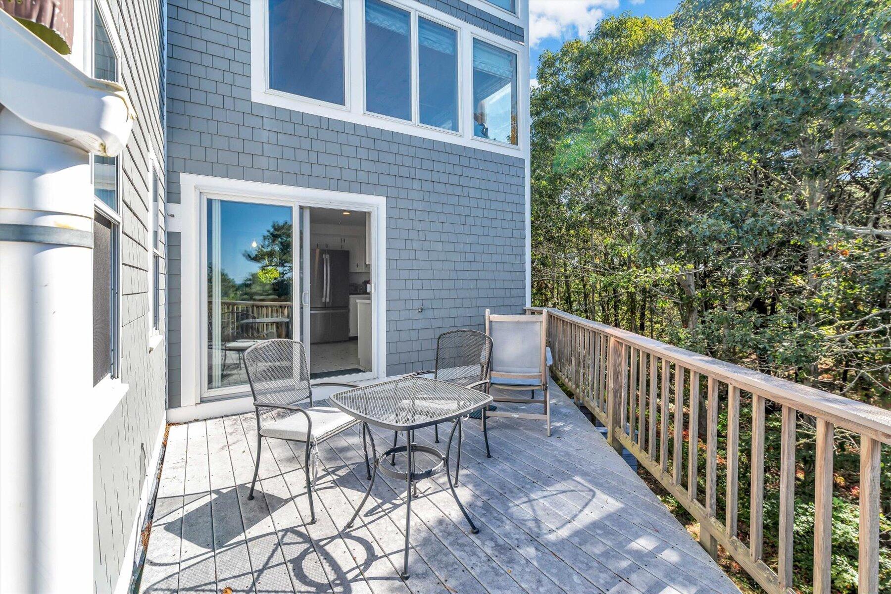 90 Ring Road Wellfleet, MA 02667 - Photo 64 of 86 a view of a chair and table in the balcony