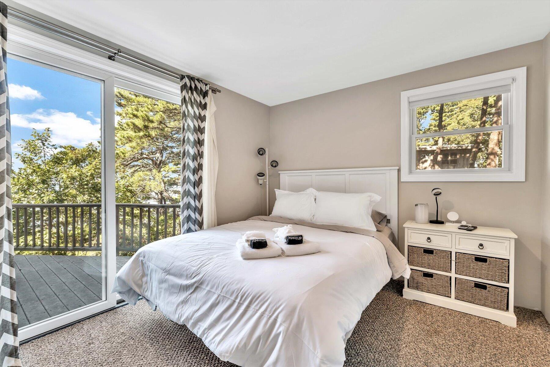 90 Ring Road Wellfleet, MA 02667 - Photo 7 of 86 a bedroom with a bed and a large window