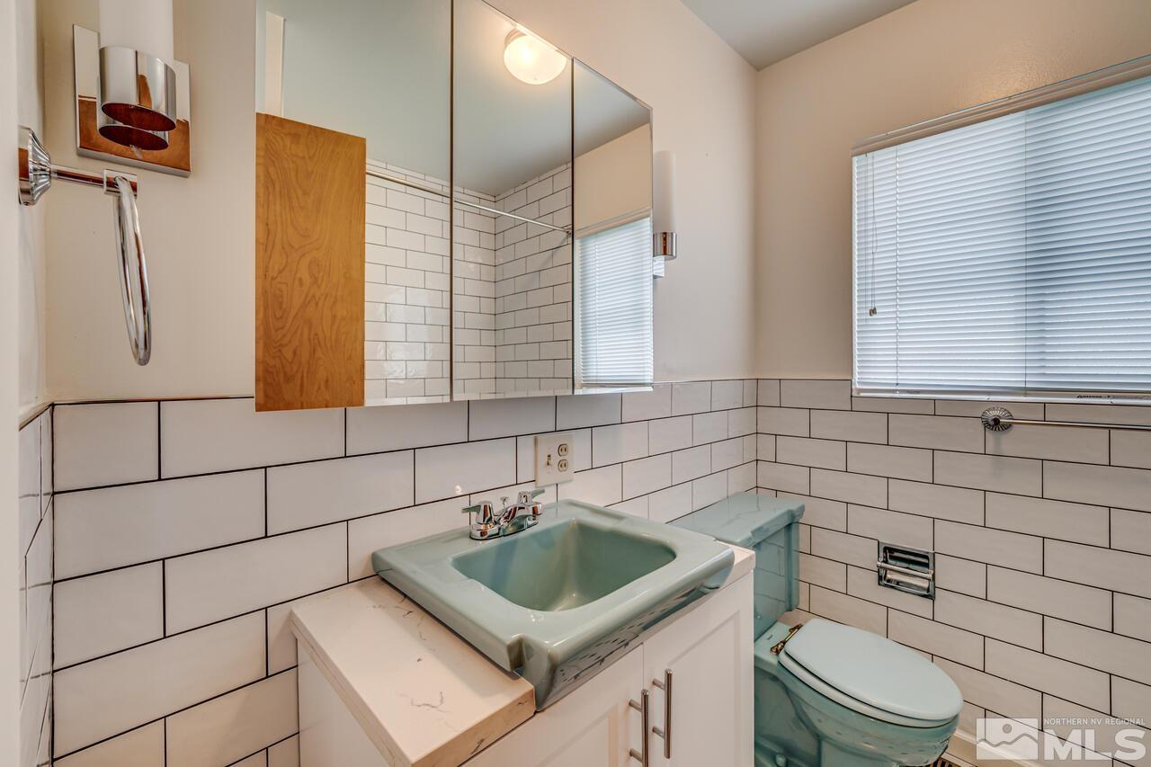 1950 Wren Street Reno, NV 89509 - Photo 14 of 24 a bathroom with a sink toilet and shower