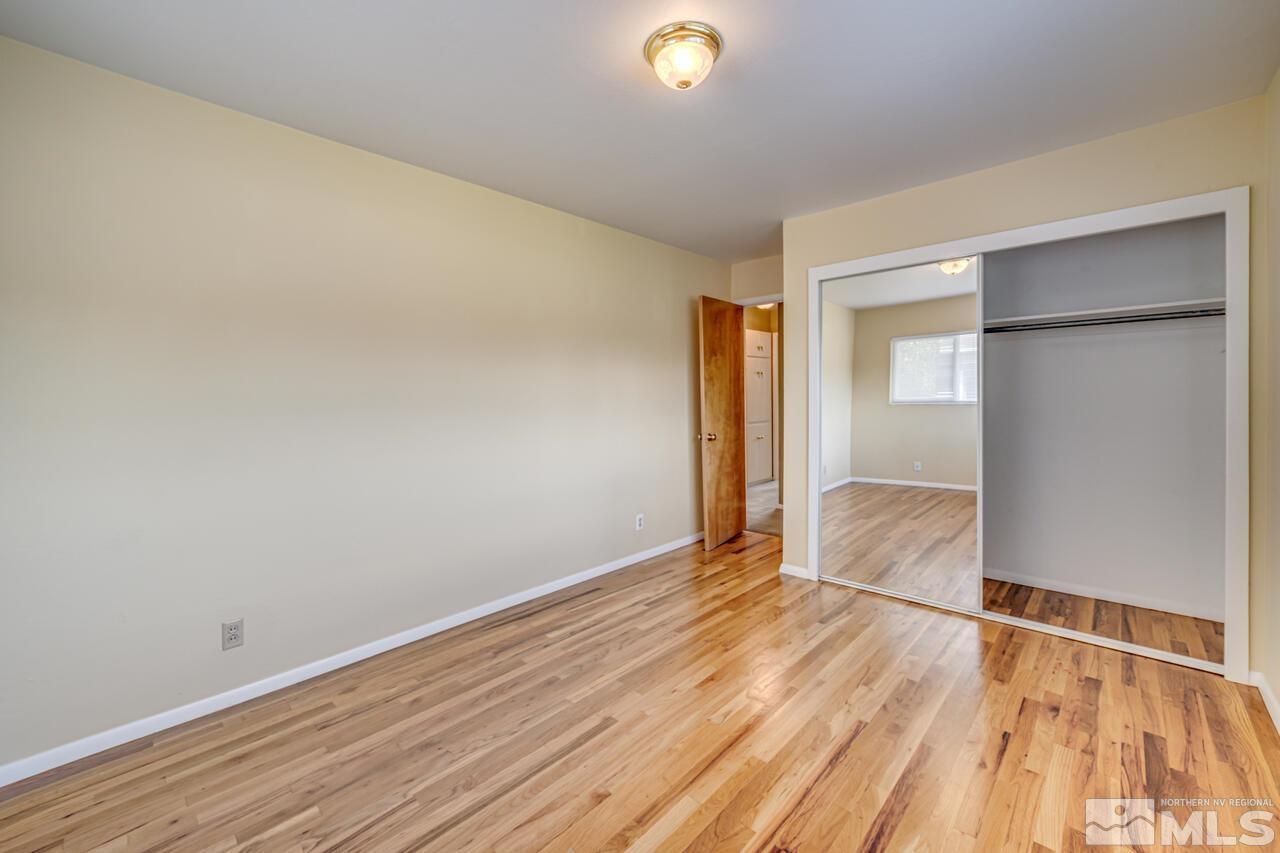 1950 Wren Street Reno, NV 89509 - Photo 18 of 24 a view of an empty room with wooden floor