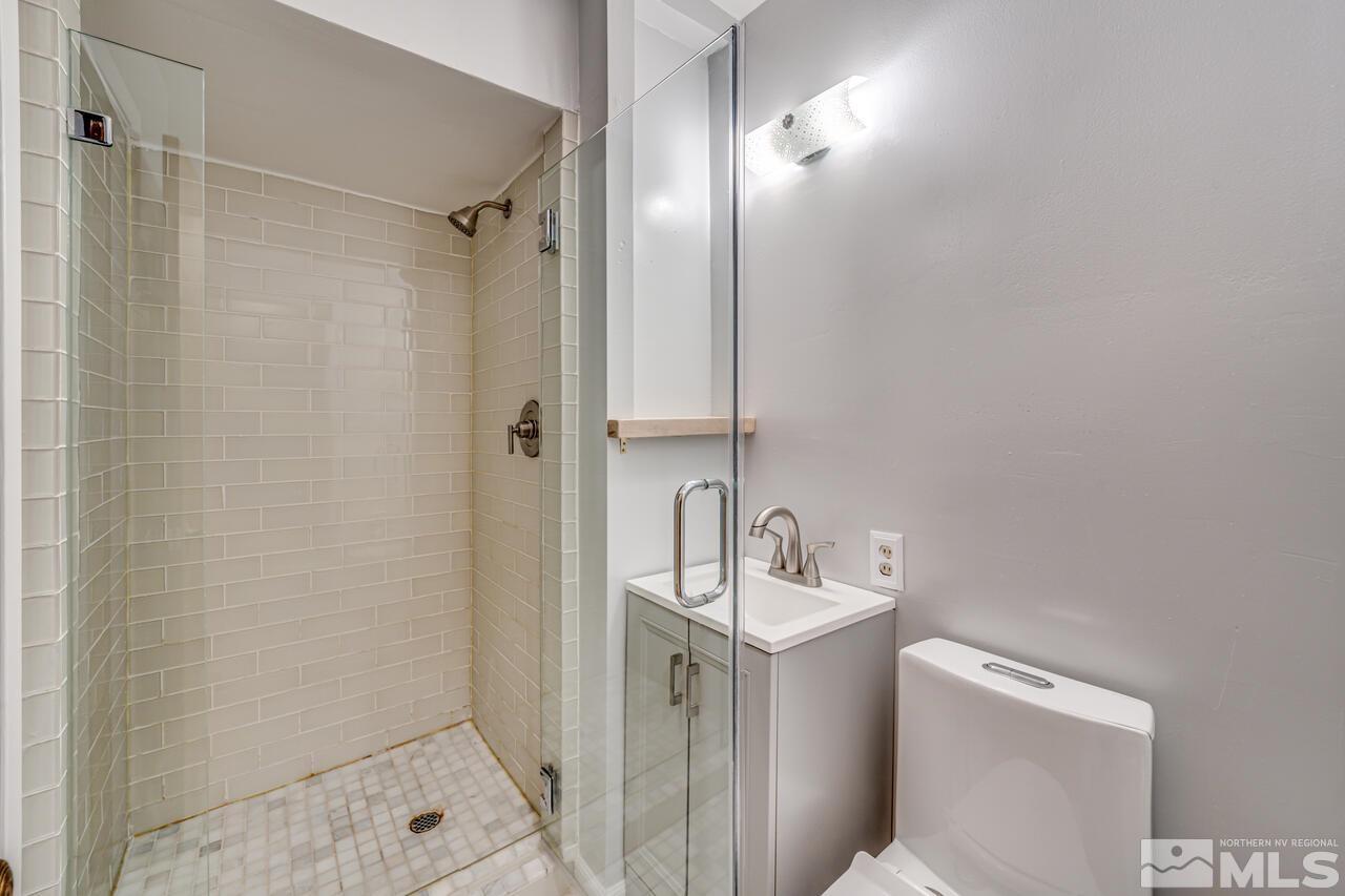 1950 Wren Street Reno, NV 89509 - Photo 19 of 24 a bathroom with a sink toilet and shower