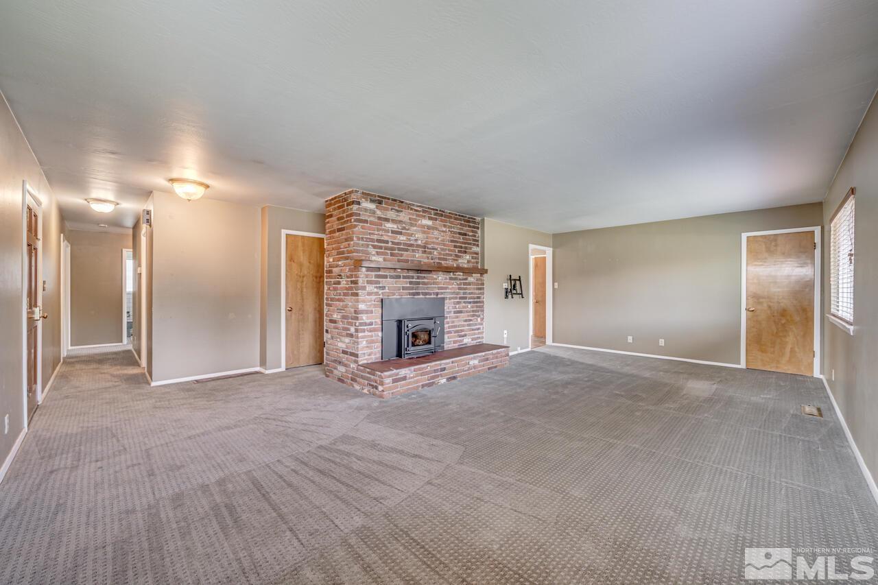 1950 Wren Street Reno, NV 89509 - Photo 3 of 24 a view of an empty room with a fireplace