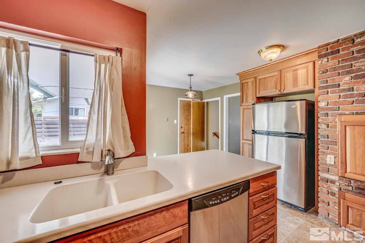 1950 Wren Street Reno, NV 89509 - Photo 8 of 24 a kitchen with a sink appliances and a window