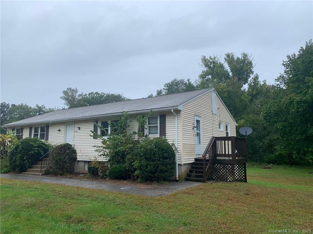 800 Mansfield City Road, Unit 15D Mansfield, CT 06268 - Photo 1 of 1 a view of a house with a yard and potted plants