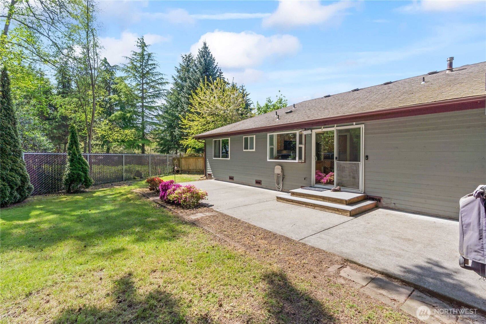 4505 Southwest 317th Place Federal Way, WA 98023 - Photo 16 of 31 a view of a house with backyard and sitting area