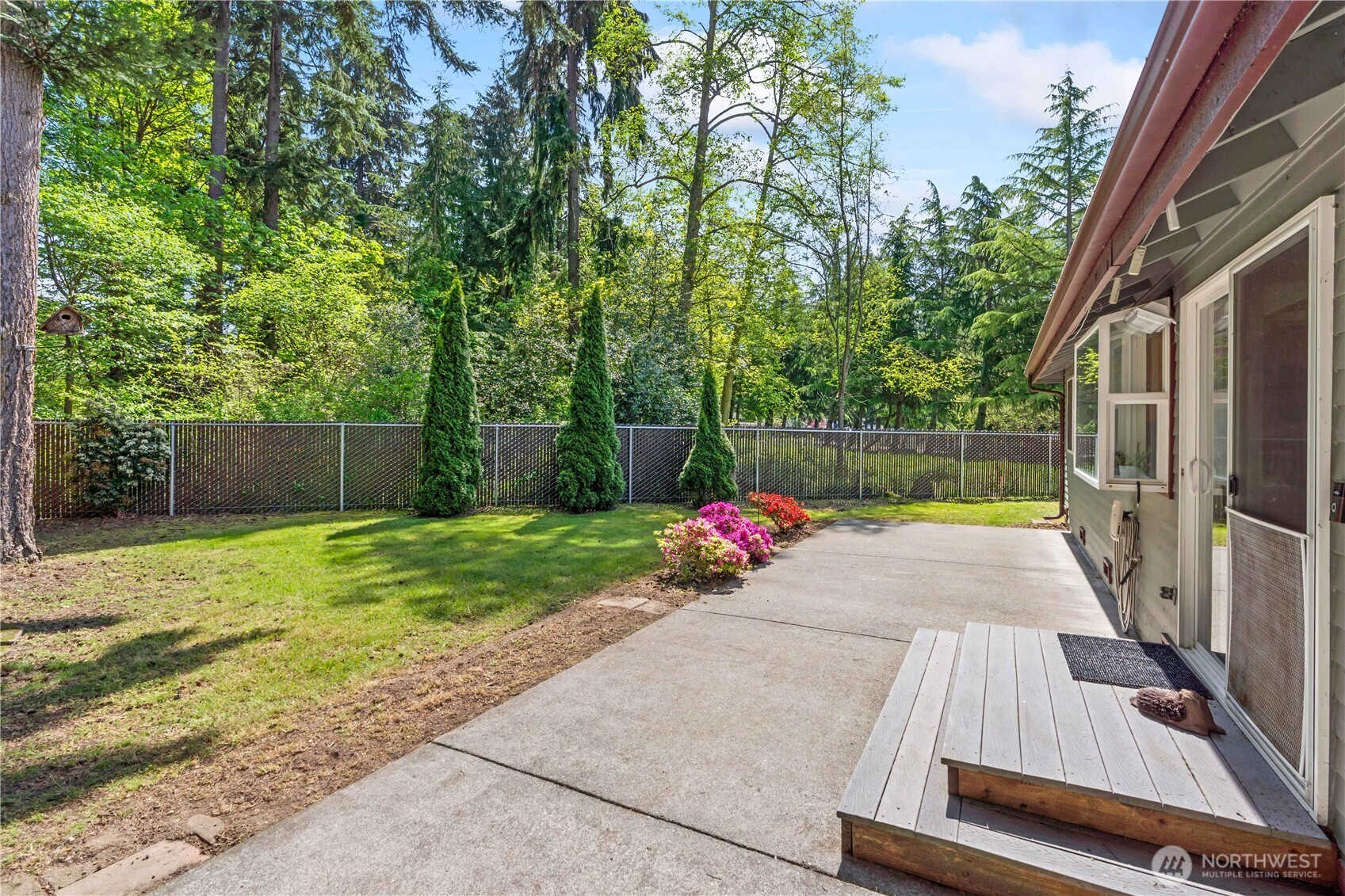 4505 Southwest 317th Place Federal Way, WA 98023 - Photo 18 of 31 a view of a backyard with sitting area