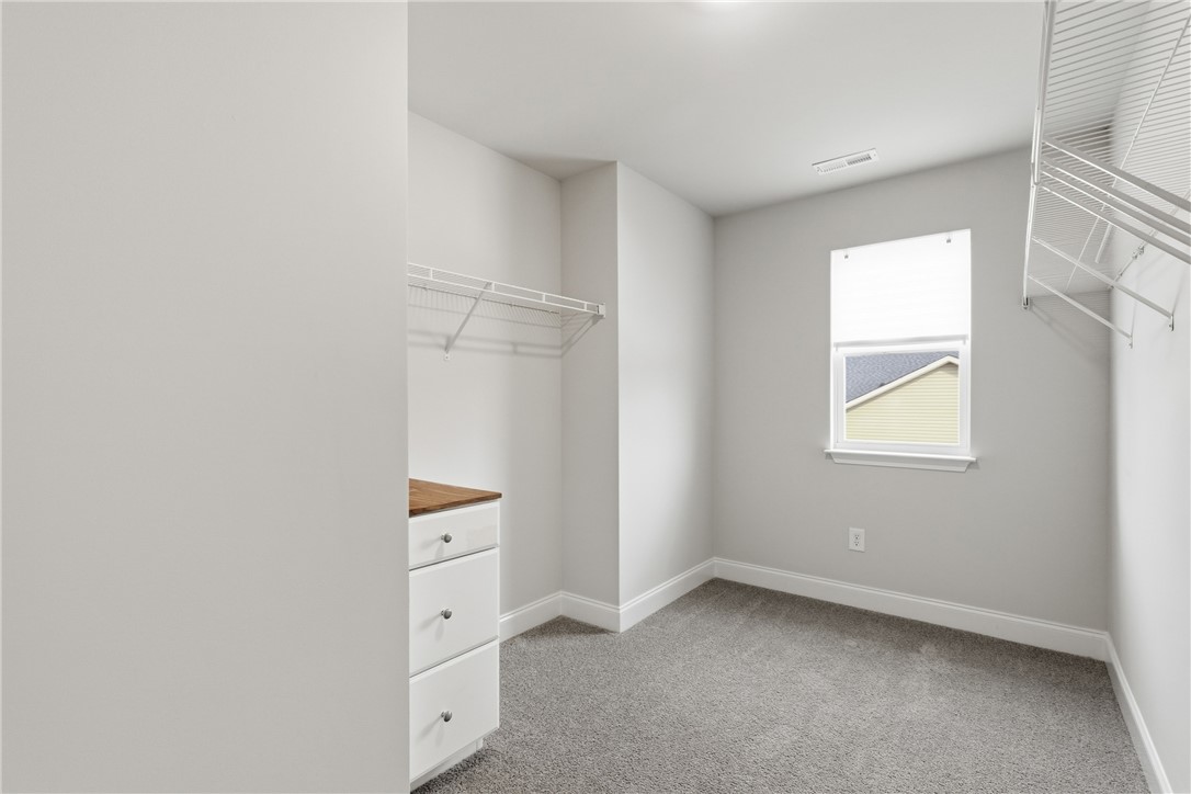 116 Ventura Street Anderson, SC 29621 - Photo 15 of 27 Ample closet space features plush neutral carpeting and a bright window.