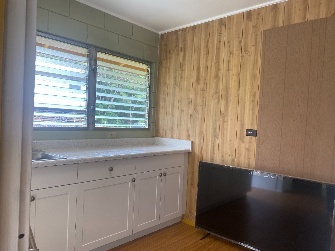 4793 Nonou Road Kapaa, HI 96746 - Photo 9 of 12 a view of a kitchen with wooden floor and a window