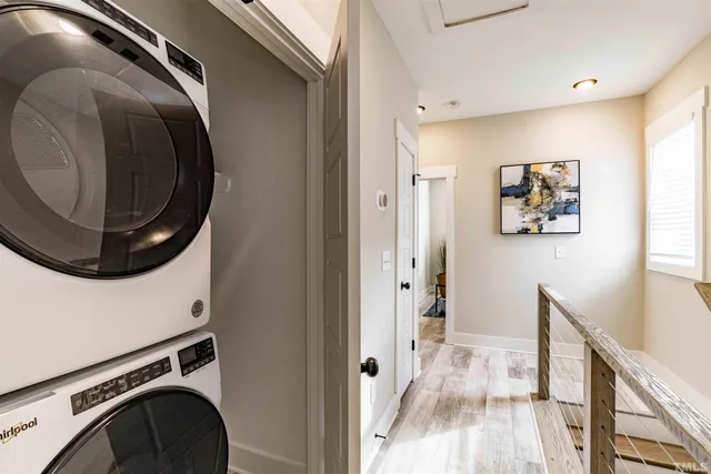 a view of a hallway with washer and dryer
