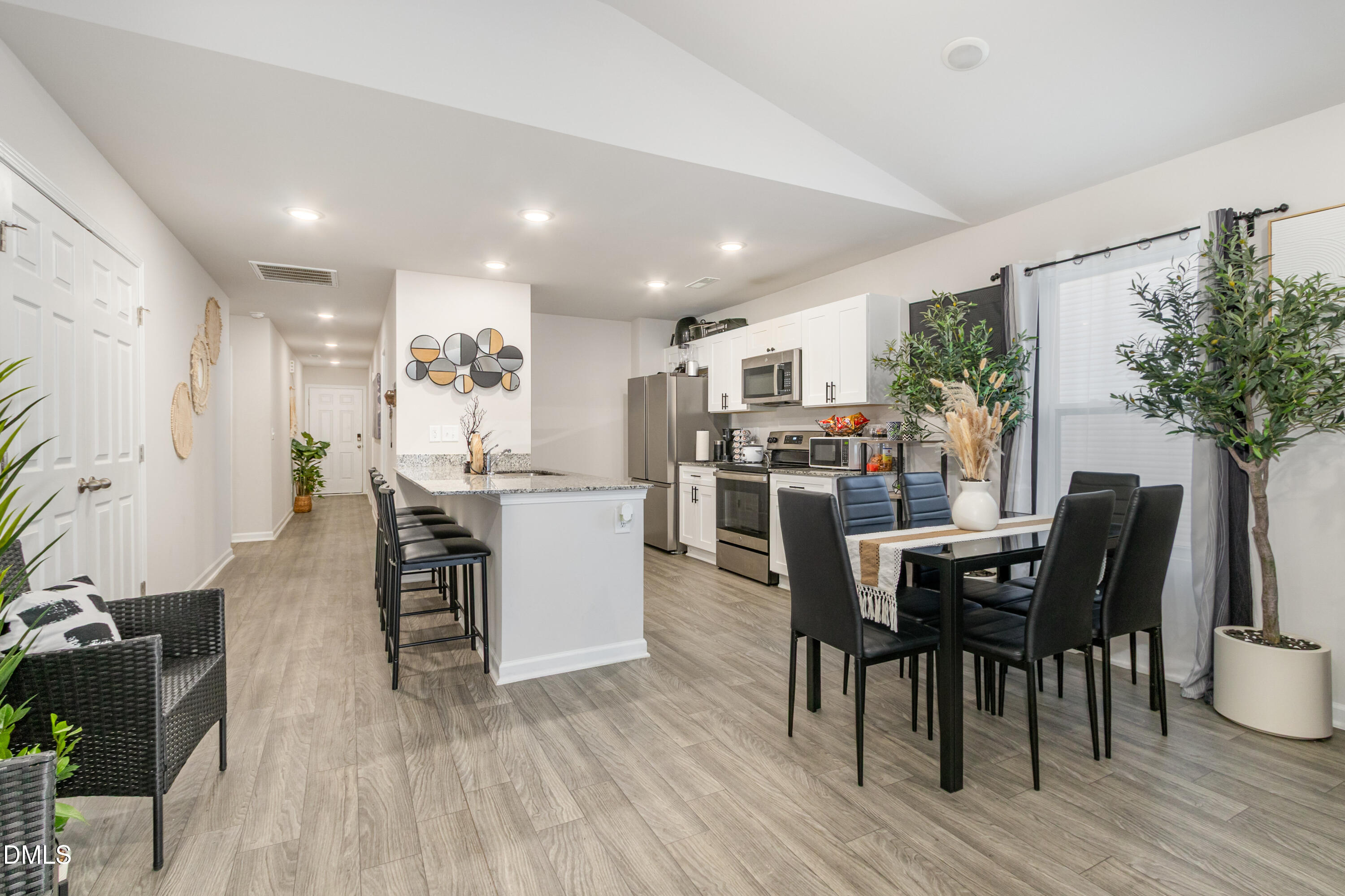196 Keith Place Roxboro, NC 27573 - Photo 11 of 28 a view of a dining room with furniture and wooden floor
