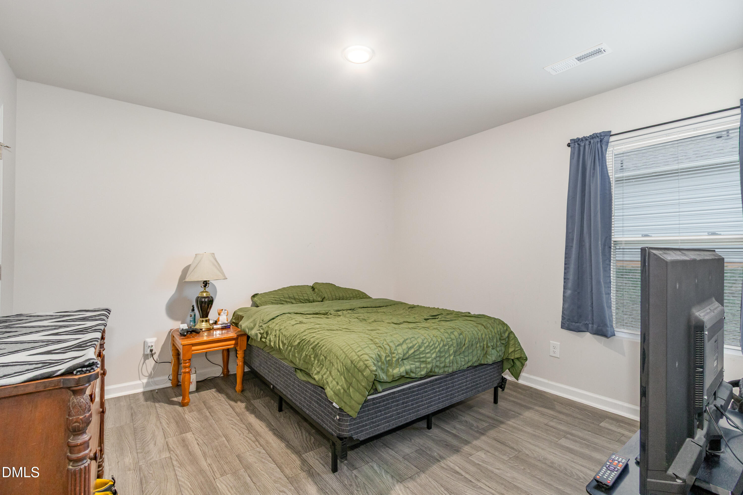 196 Keith Place Roxboro, NC 27573 - Photo 22 of 28 a bedroom with a bed and a table