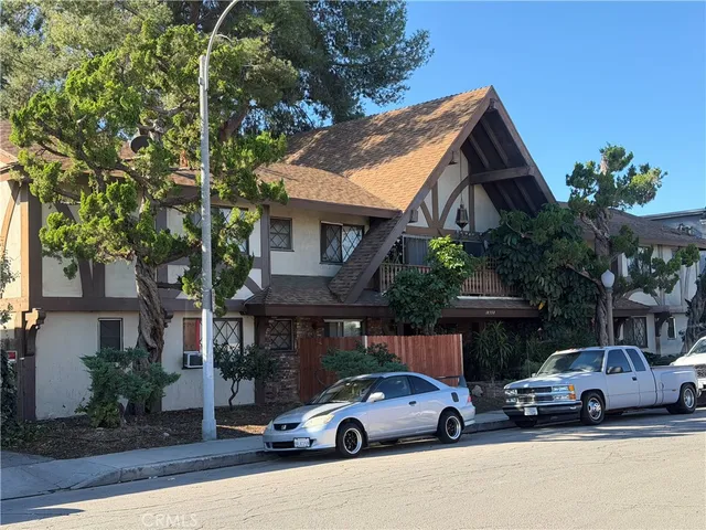 a view of street with parked cars