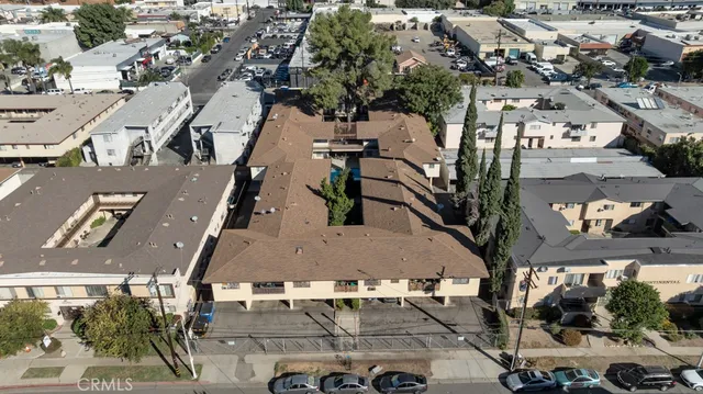 an aerial view of residential houses with outdoor space