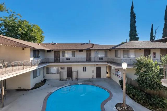 a view of a swimming pool with chairs