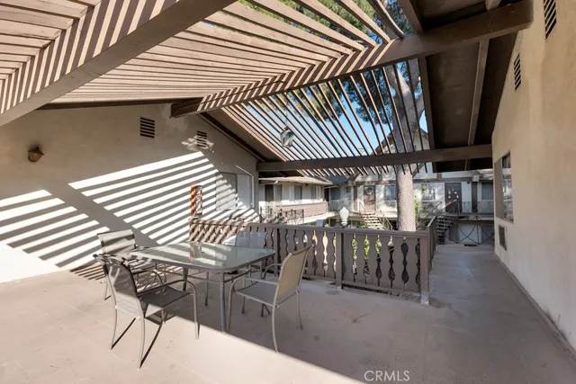 a view of dinning table and chairs in patio