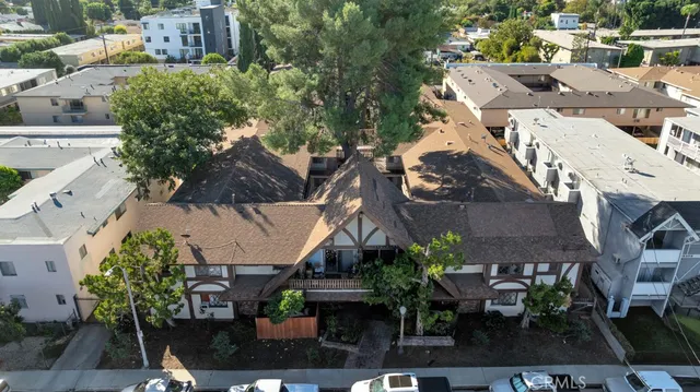 an aerial view of residential houses with outdoor space
