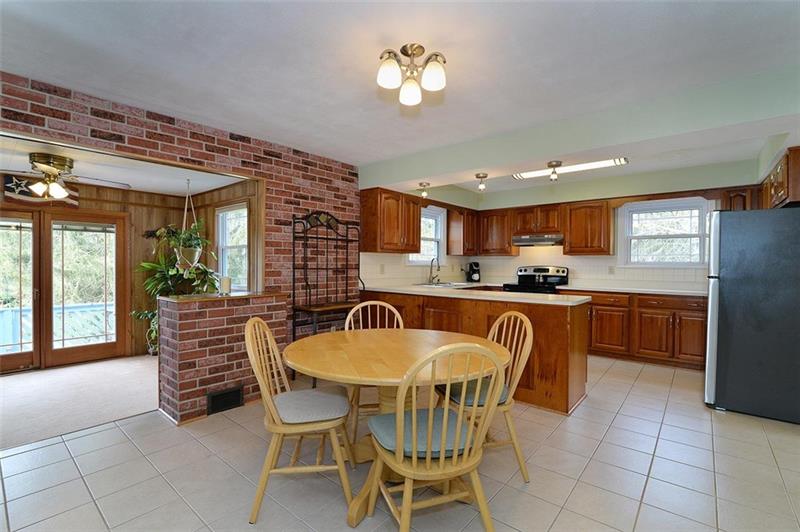 2595 Cole Road Wexford, PA 15090 - Photo 12 of 25 Eat-in kitchen with access to outdoor deck and 4 seasons room.