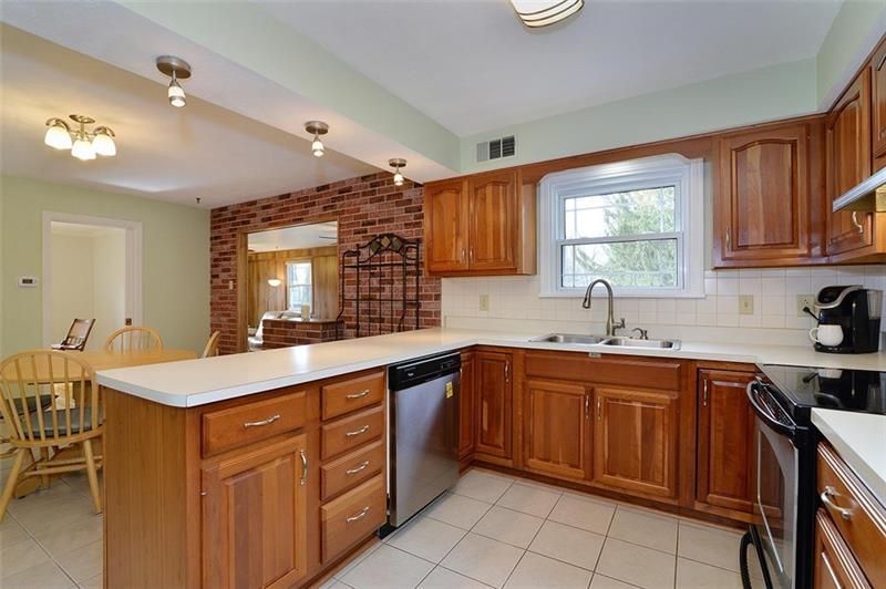 2595 Cole Road Wexford, PA 15090 - Photo 14 of 25 Kitchen with view of backyard outdoor space and upgraded ceramic flooring.