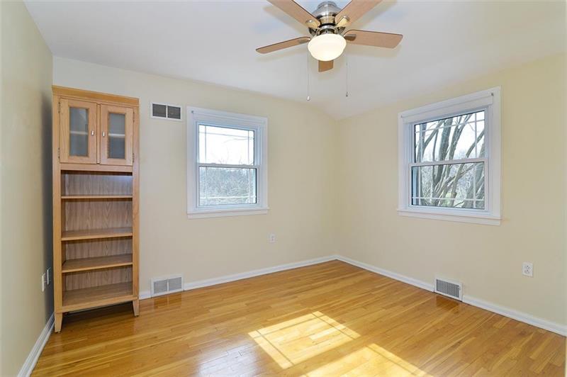 2595 Cole Road Wexford, PA 15090 - Photo 22 of 25 Bedroom 4 with natural lighting and original hardwood flooring. New ceiling light and stainless matching fans.