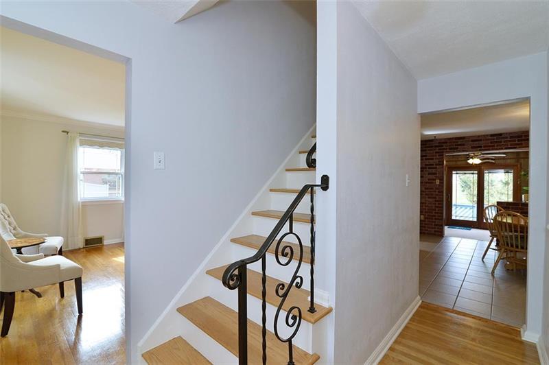 2595 Cole Road Wexford, PA 15090 - Photo 7 of 25 Easy access to first floor living room with gas fireplace, or straight into the kitchen dining area.