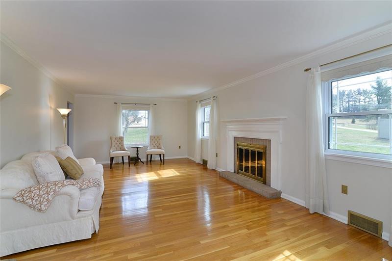 2595 Cole Road Wexford, PA 15090 - Photo 10 of 25 View coming from the kitchen into the main floor living room with plenty of natural lighting.