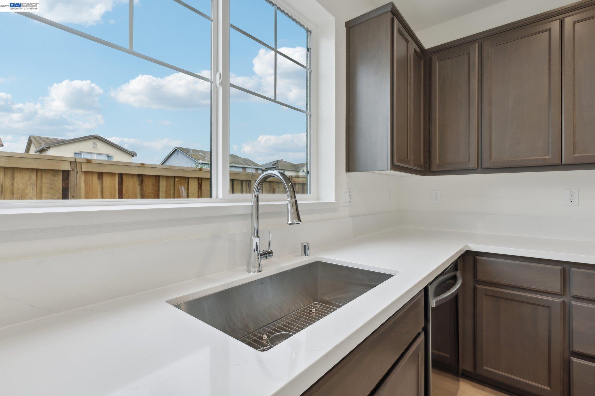 230 Mindy Way Pittsburg, CA 94565 - Photo 11 of 33 a kitchen with a sink cabinets and a window