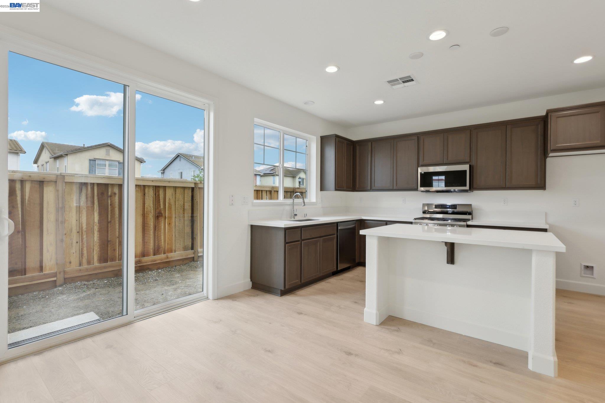 230 Mindy Way Pittsburg, CA 94565 - Photo 15 of 33 a kitchen with counter top space cabinets and stainless steel appliances
