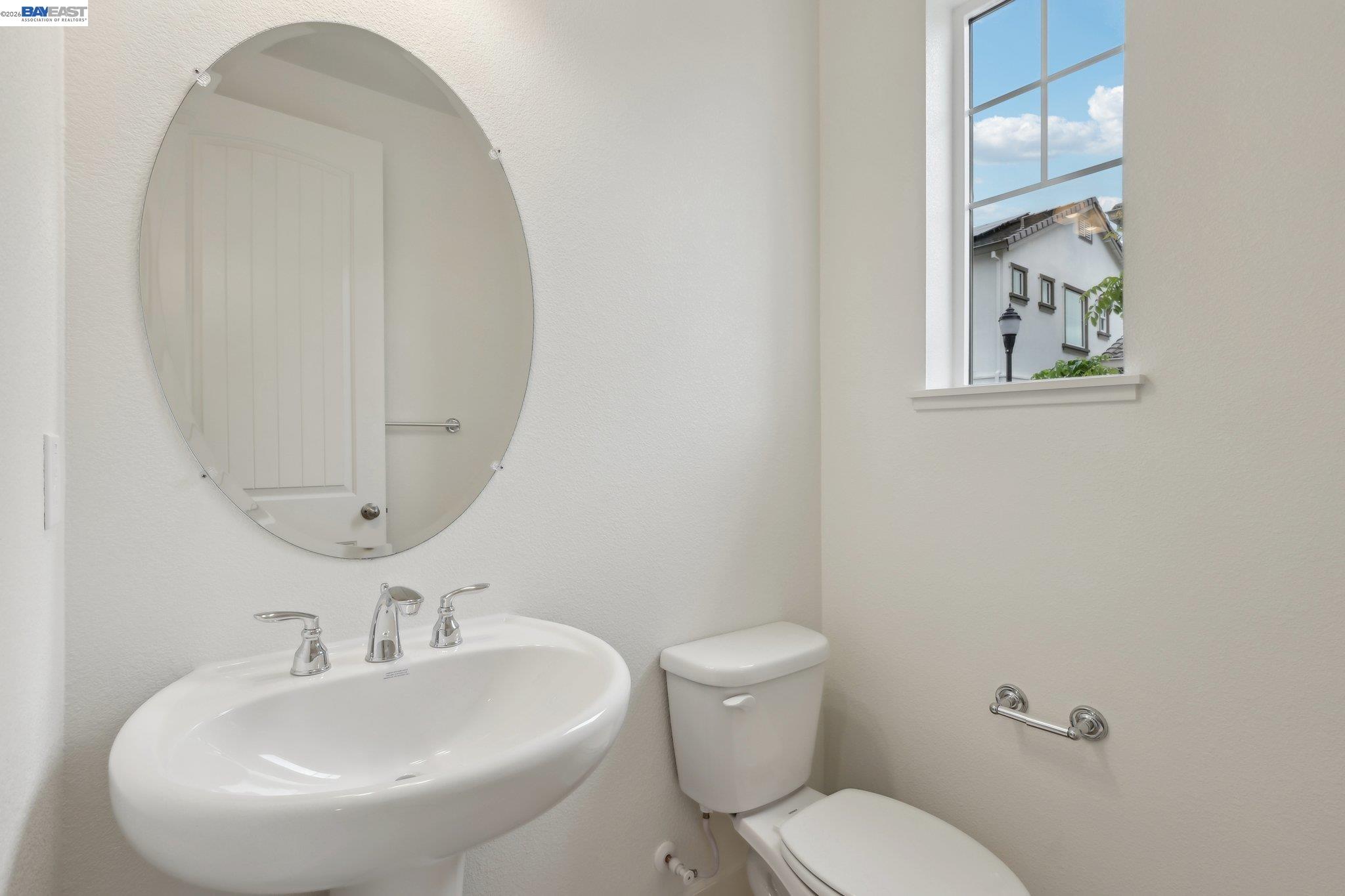 230 Mindy Way Pittsburg, CA 94565 - Photo 16 of 33 a bathroom with a toilet sink and mirror