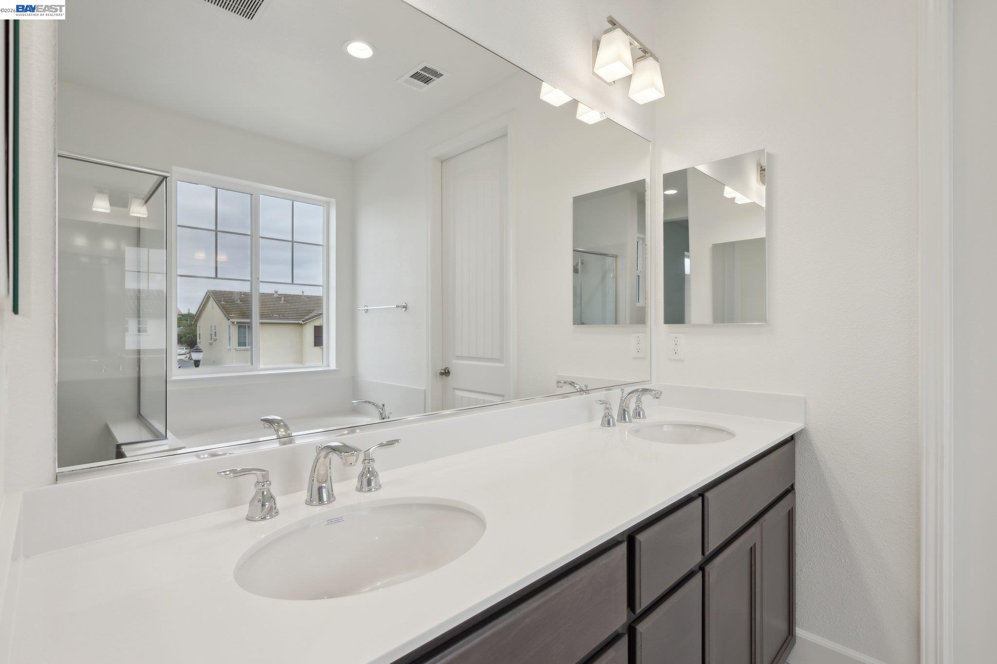 230 Mindy Way Pittsburg, CA 94565 - Photo 21 of 33 a bathroom with a sink vanity and a mirror
