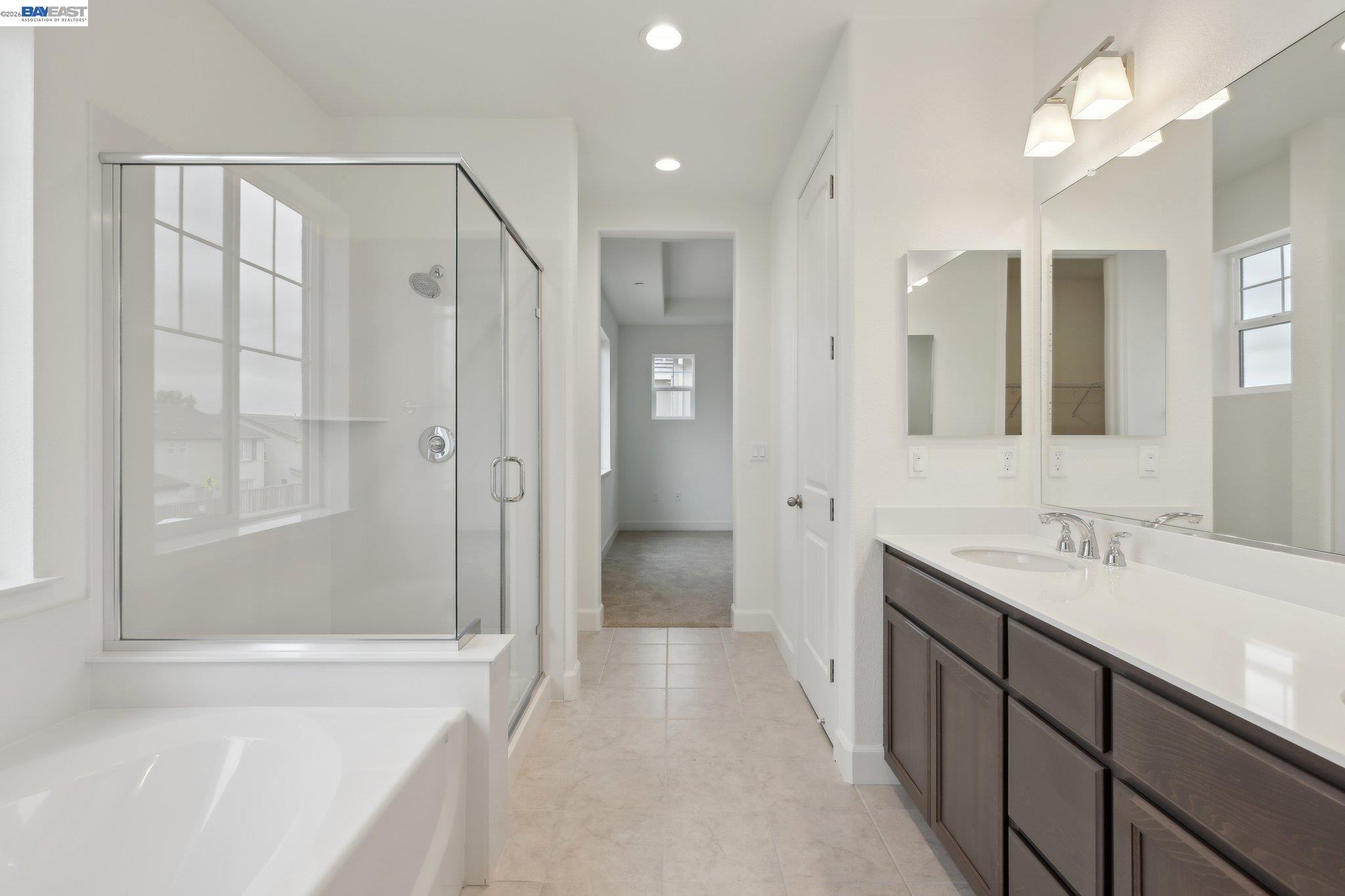 230 Mindy Way Pittsburg, CA 94565 - Photo 22 of 33 a spacious bathroom with a mirror a shower and a sink