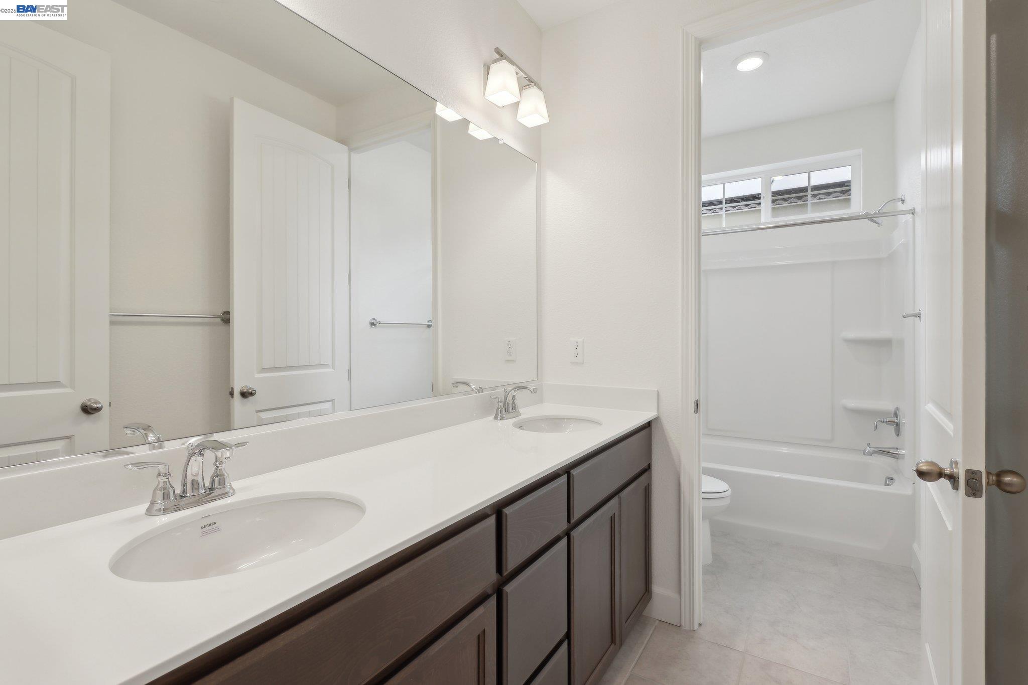 230 Mindy Way Pittsburg, CA 94565 - Photo 25 of 33 a bathroom with a granite countertop sink tub and a mirror