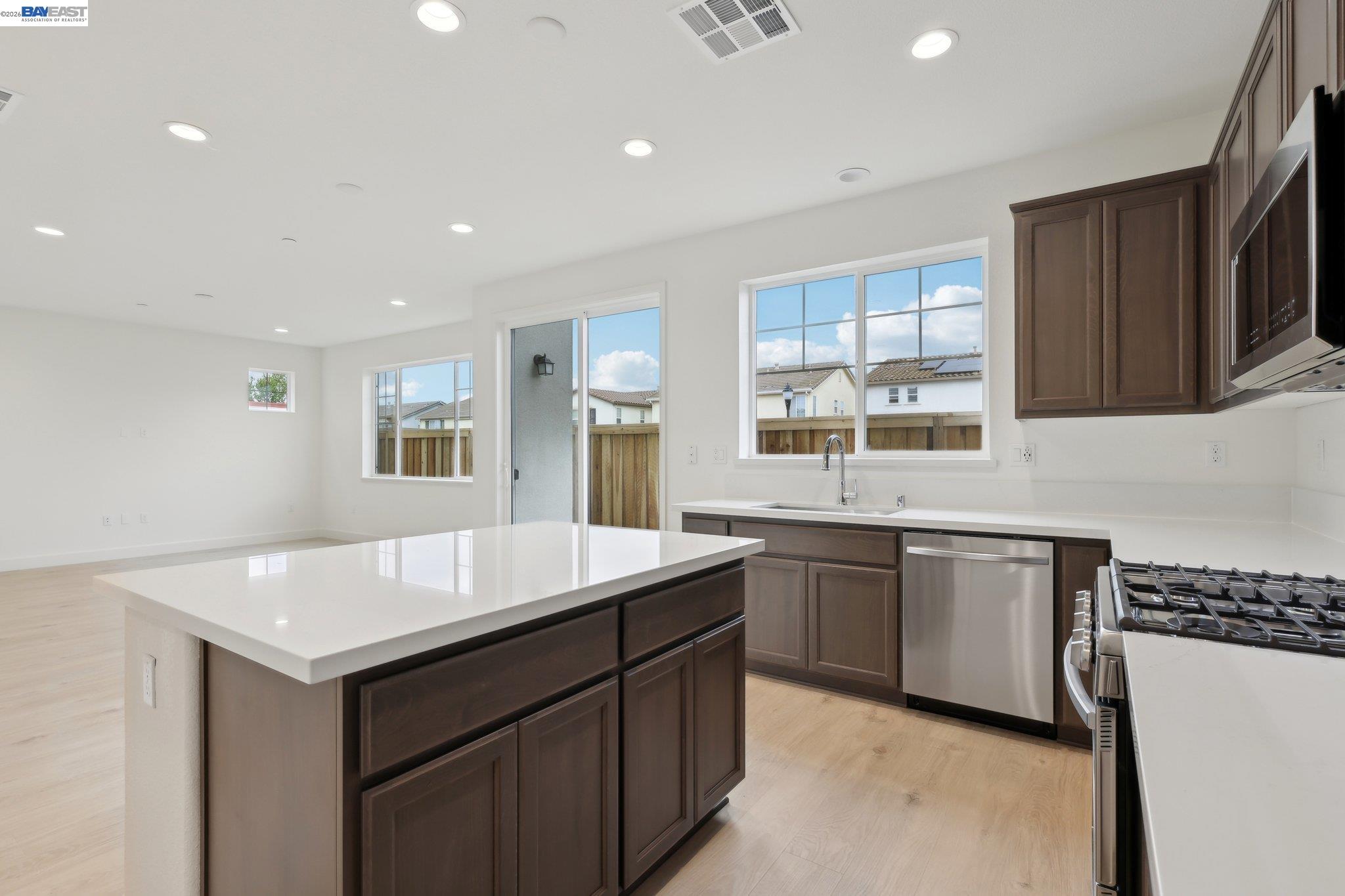230 Mindy Way Pittsburg, CA 94565 - Photo 10 of 33 a kitchen with a sink stove and microwave