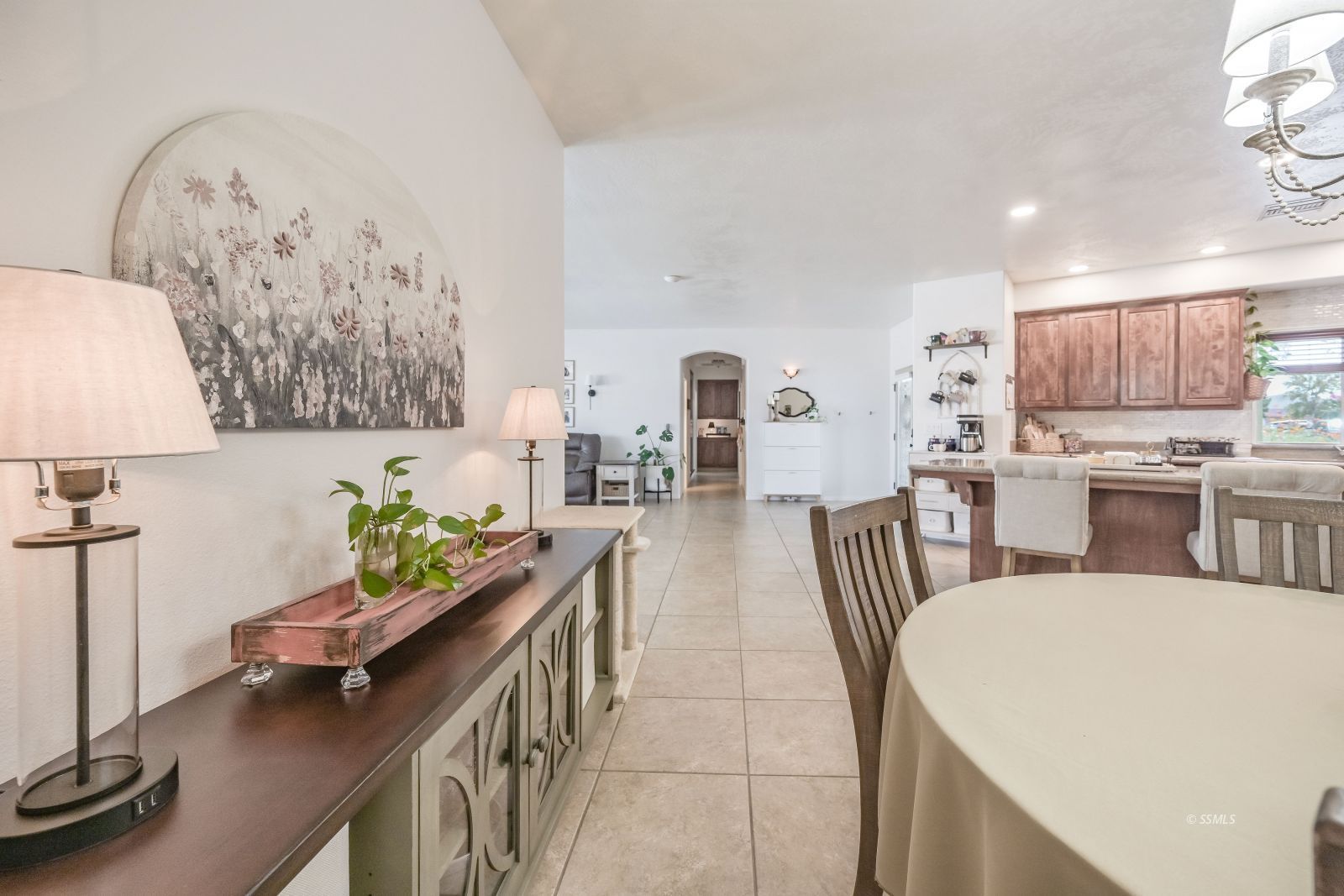 400 Acacia Street Ridgecrest, CA 93555 - Photo 15 of 45 a dining room with furniture and a chandelier
