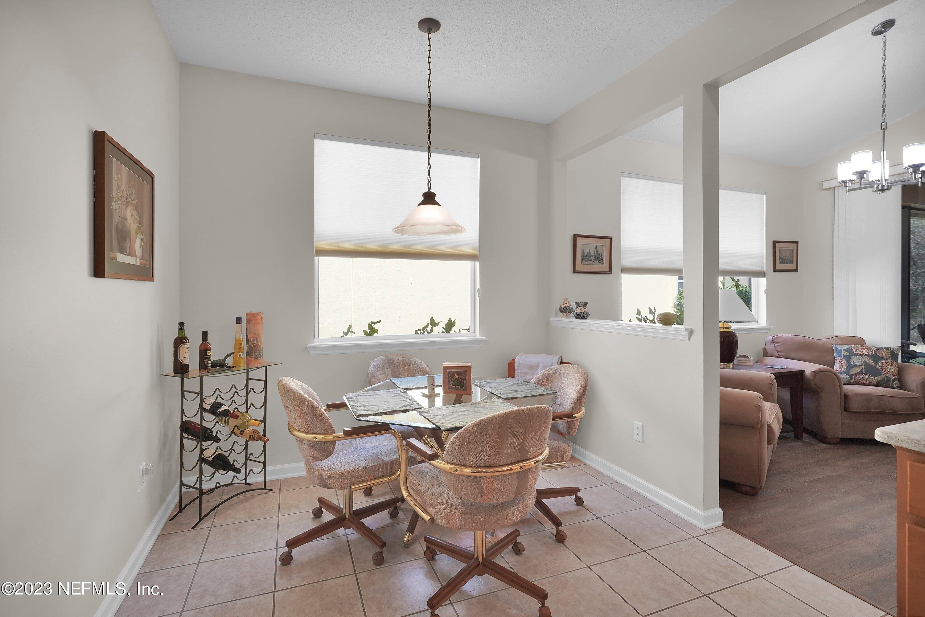 746 Copperhead Circle St. Augustine, FL 32092 - Photo 13 of 40 a view of a dining room with furniture window and wooden floor