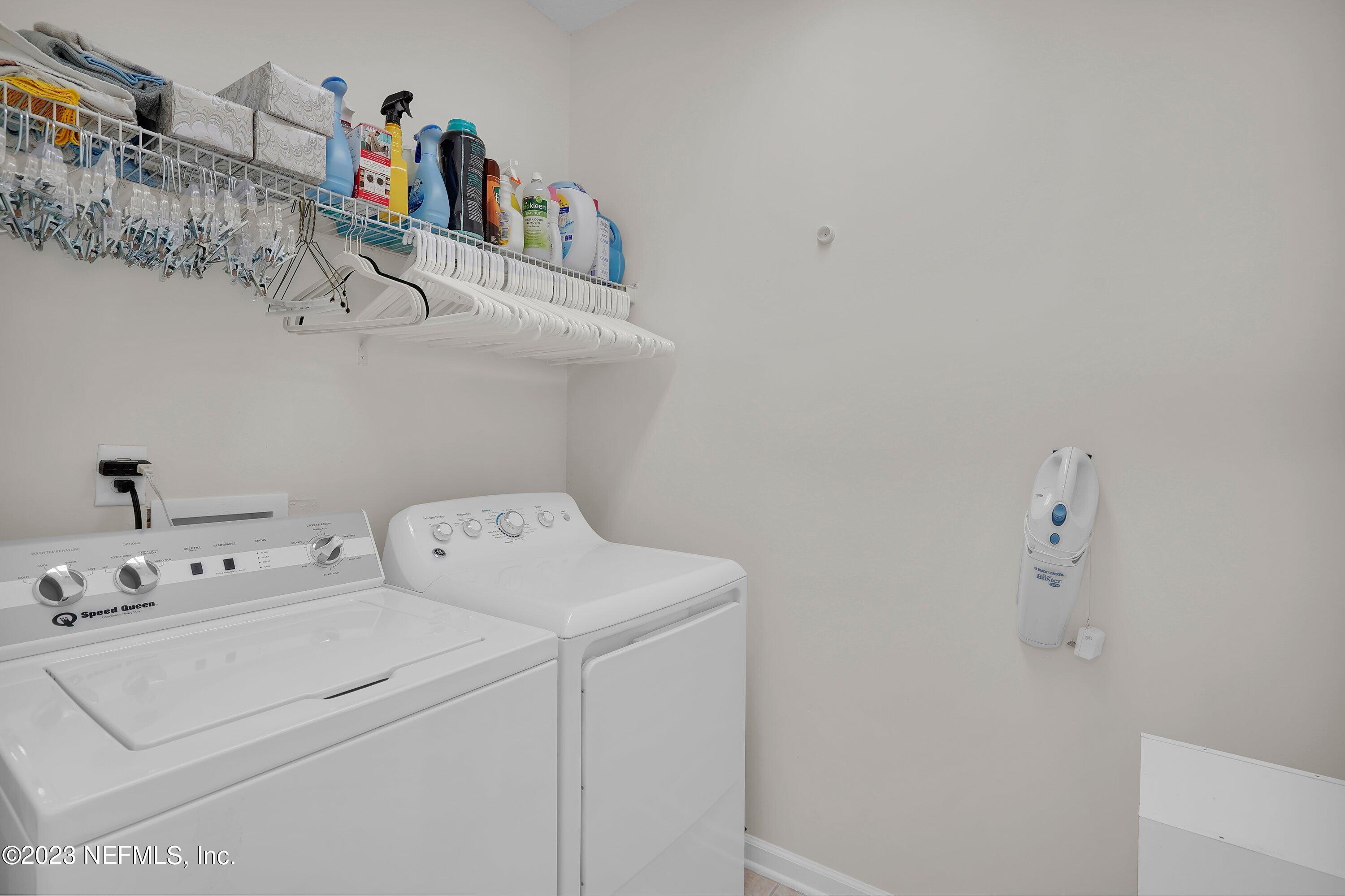 746 Copperhead Circle St. Augustine, FL 32092 - Photo 14 of 40 a utility room with dryer and washer