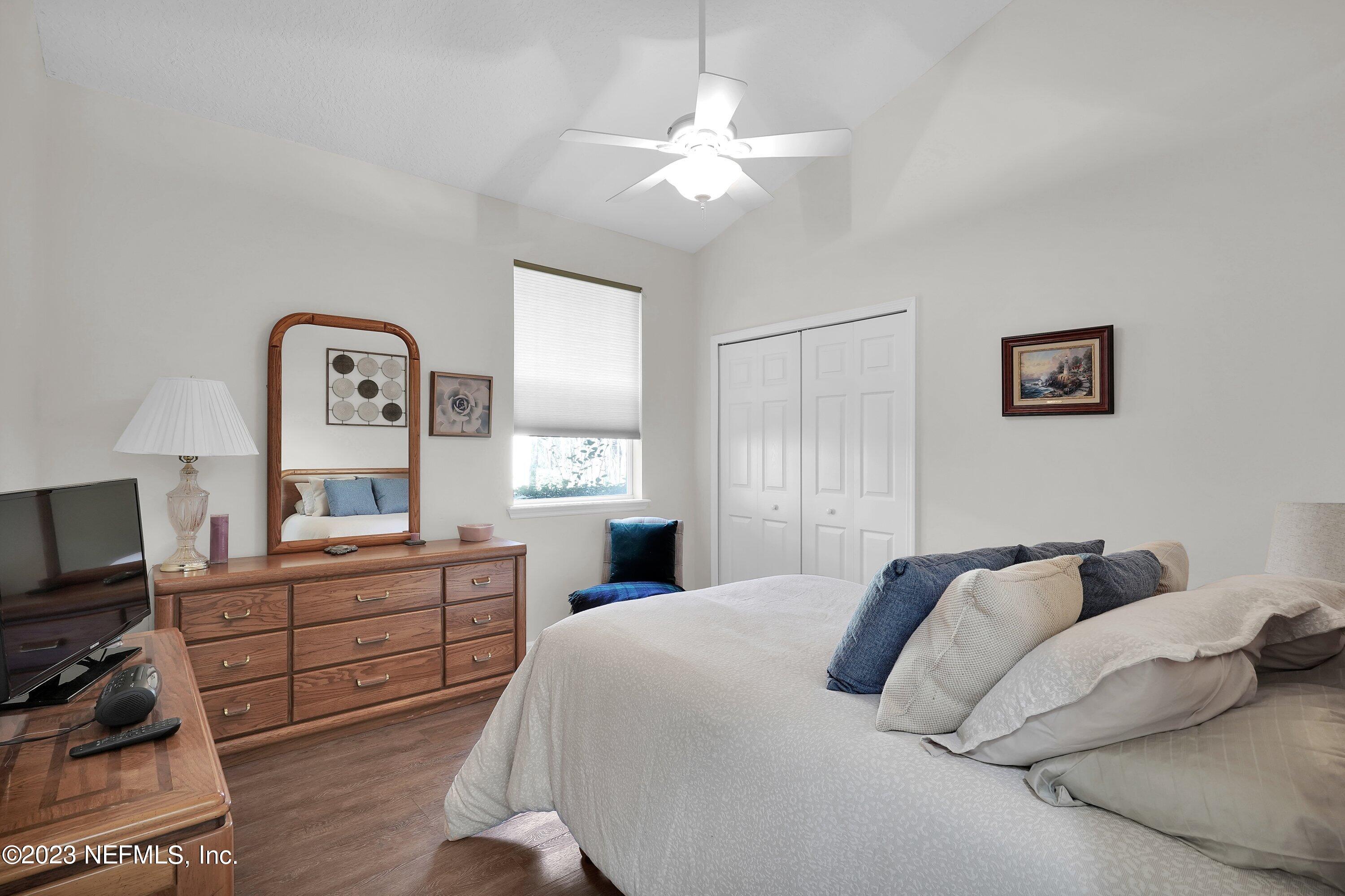 746 Copperhead Circle St. Augustine, FL 32092 - Photo 16 of 40 a bedroom with a bed and a flat screen tv