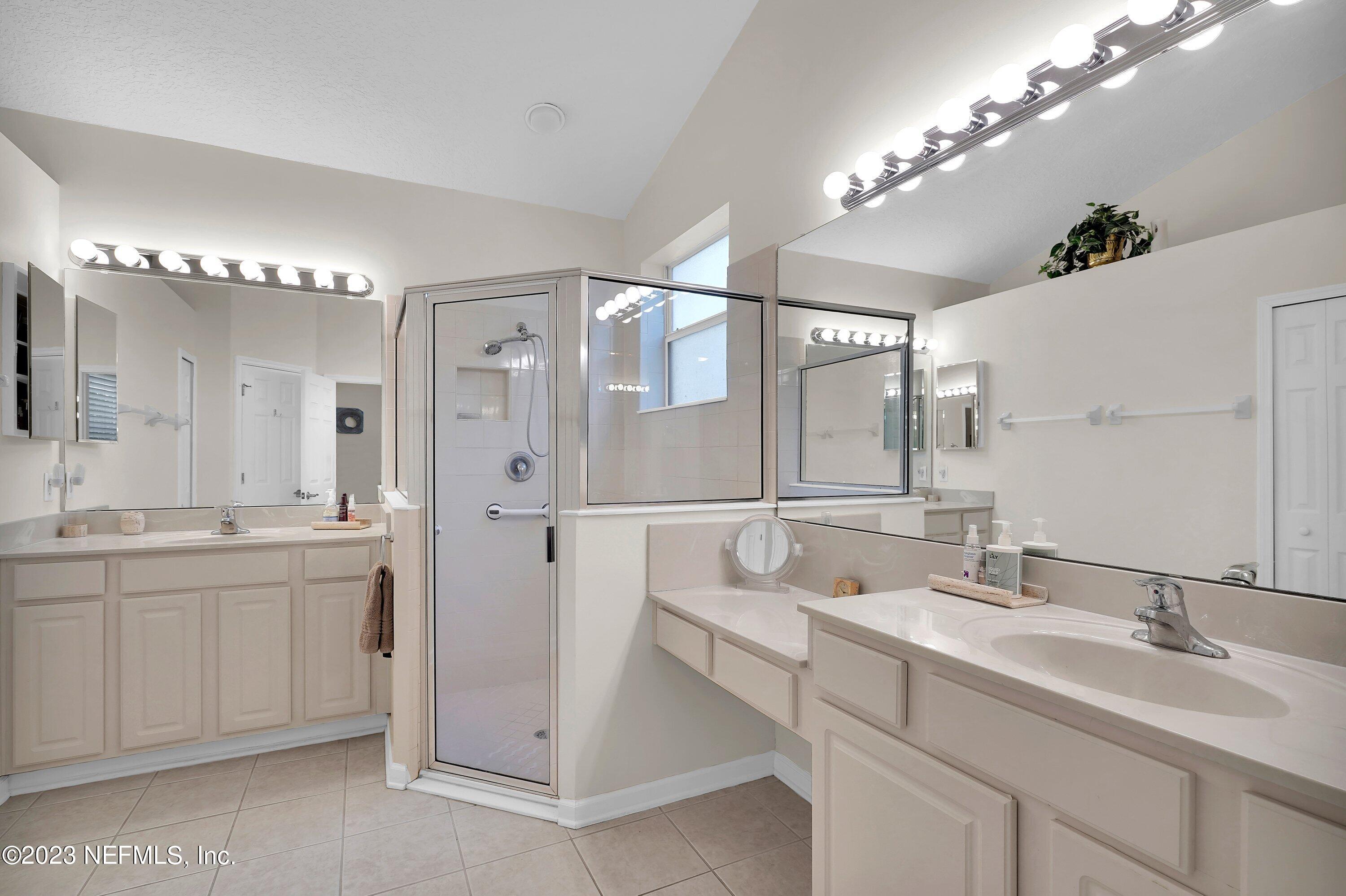 746 Copperhead Circle St. Augustine, FL 32092 - Photo 19 of 40 a bathroom with a double vanity sink mirror and double