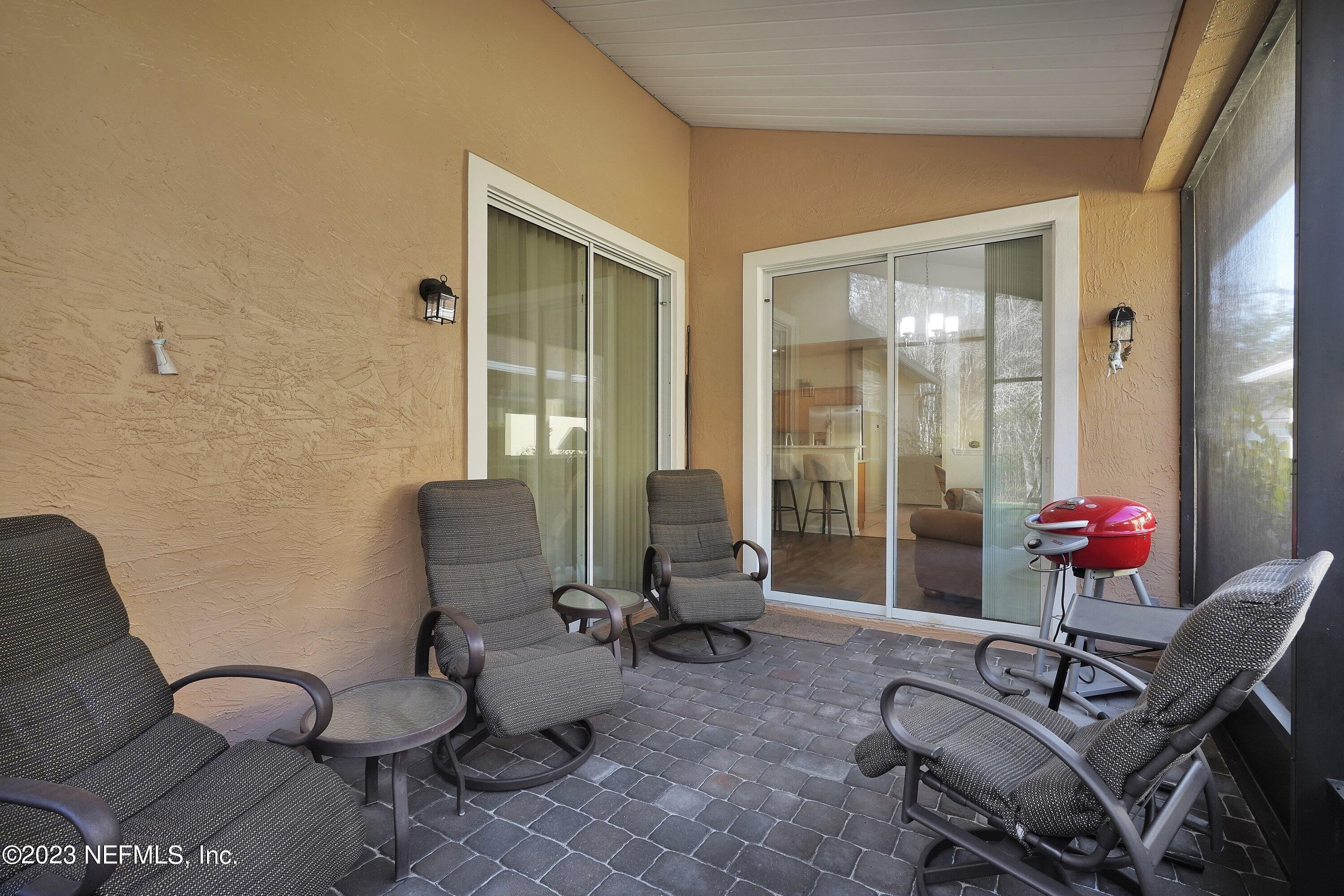 746 Copperhead Circle St. Augustine, FL 32092 - Photo 22 of 40 a living room with furniture and two windows