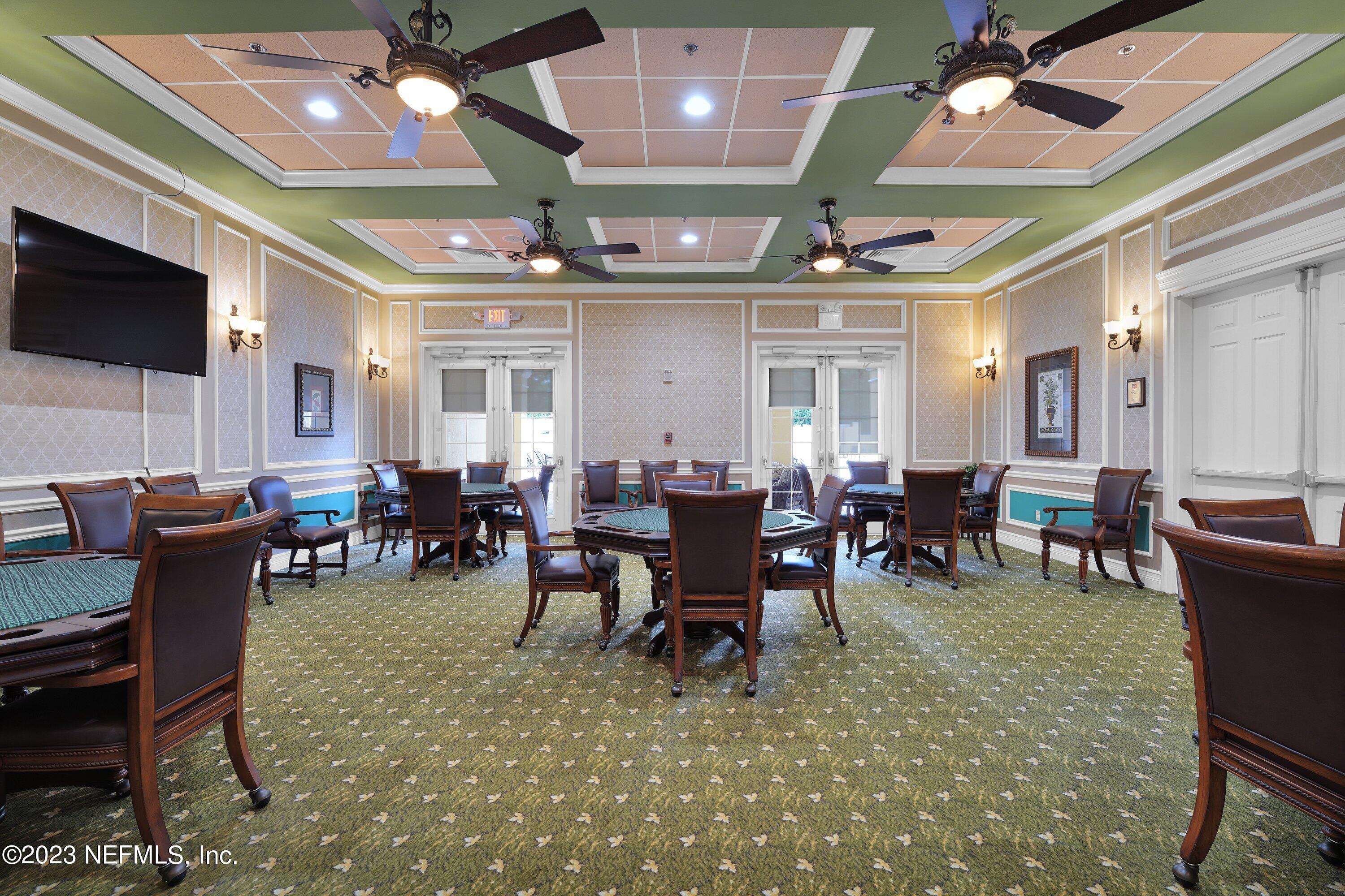 746 Copperhead Circle St. Augustine, FL 32092 - Photo 28 of 40 a view of a dining room with furniture and chandelier
