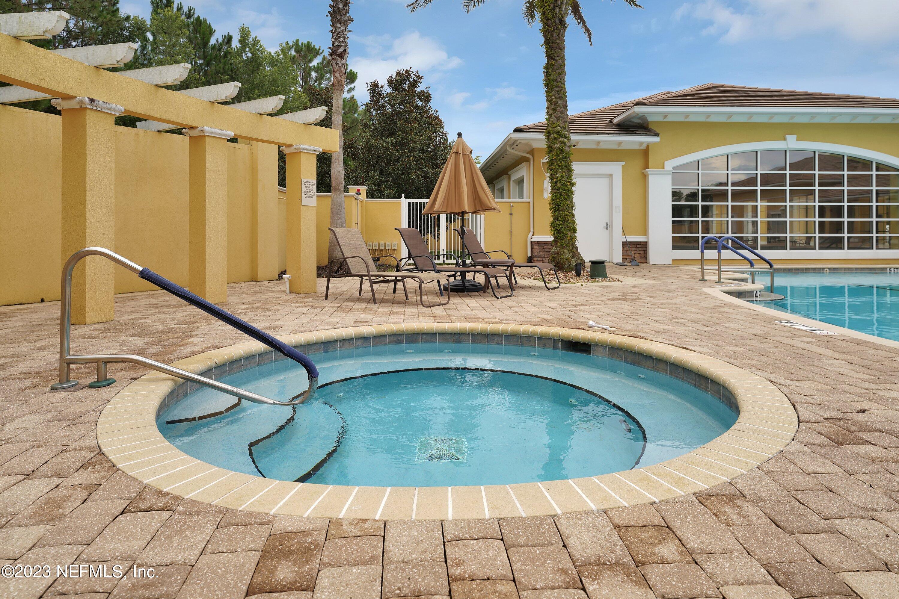 746 Copperhead Circle St. Augustine, FL 32092 - Photo 32 of 40 a view of a swimming pool with a patio