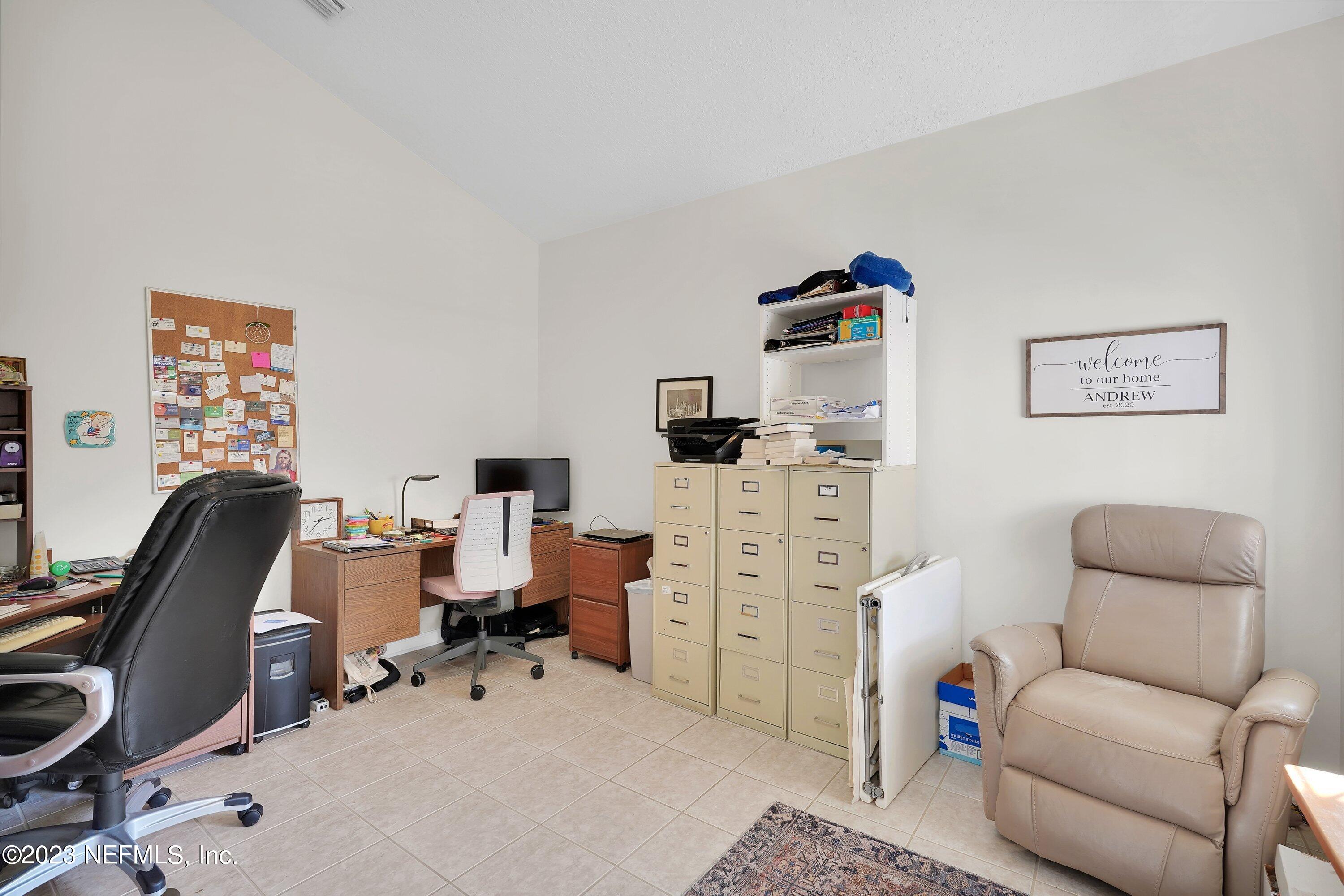 746 Copperhead Circle St. Augustine, FL 32092 - Photo 5 of 40 a room with furniture a rug and gym equipment